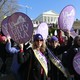 Equal Rights Amendment supporters holding up "VA 38 ratify ERA" signs