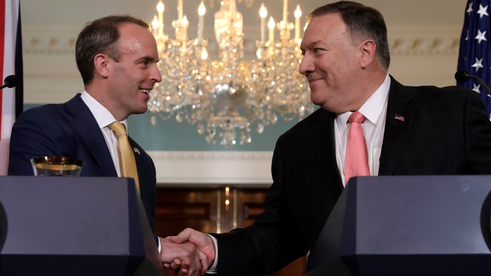 Mike Pompeo (Right) shakes hands with Dominic Raab at the state department in Washington D.C.