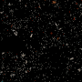 A sphere of small particles expands and contracts against a black background.