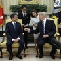 President Trump gestures his hand towards South Korean President Moon Jae-in
