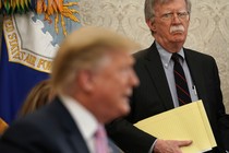 John Bolton looks at Donald Trump