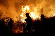 Firefighters battle a blaze.