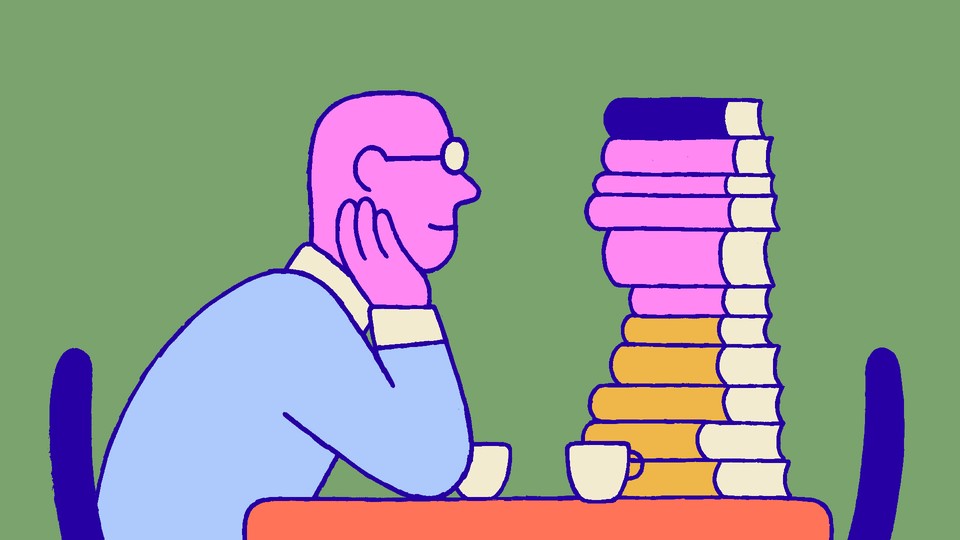Man staring longingly at stack of books