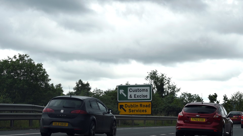 A sign for customs and excise is seen on the motorway approaching the border between Northern Ireland and Ireland on July 13, 2017.