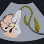 An illustration of an sonogram with a weeping flower inside.