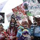 A group of mostly young white women cheer on the death of Roe. (Olivier Douliery / Getty)