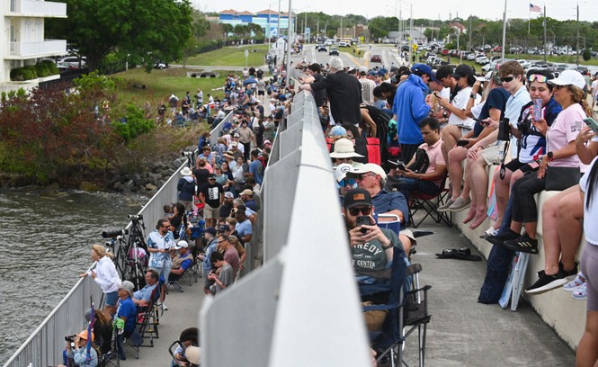 People gathering on a bridge