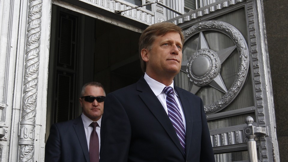 Michael McFaul exits the Russian foreign ministry in Moscow.