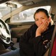 Alma Alvarez sitting in the front seat of her car