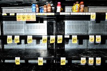 An almost empty grocery aisle.