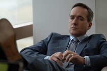 Tom Wambsgans from "Succession" sits in a chair, looking upset.
