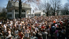 Spectators watch as runners crowd together at the start of the 1973 Boston Marathon.