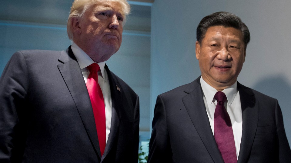 President Donald Trump and Chinese President Xi Jinping stand side by side.