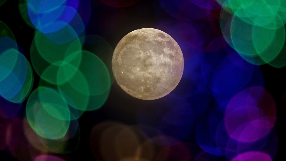 A photo of the moon through colored lenses