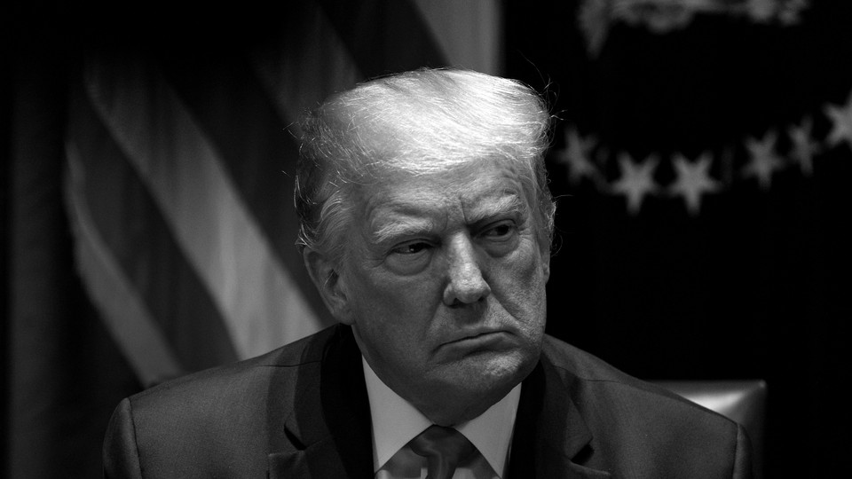 A black-and-white photograph of Donald Trump