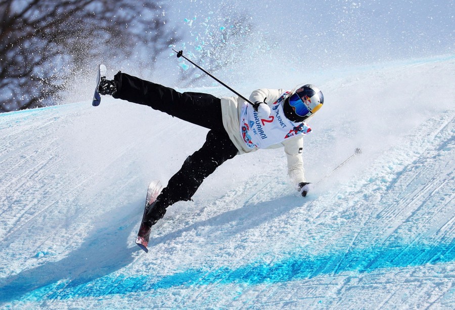 A skier falls during a competition.