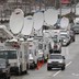 Television satellite trucks line an Oregon roadway near the scene of a mall shooting in 2012.