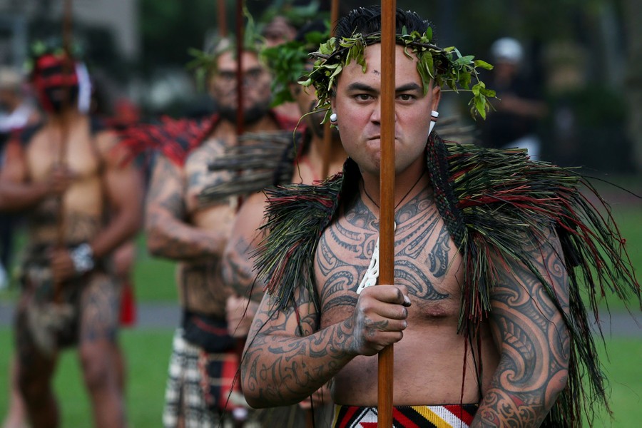 People in traditional Māori dress gather for a ceremony.