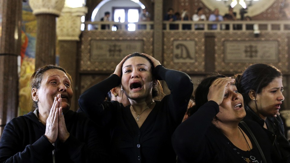 Women cry during the funeral for those killed in an ISIS attack in Alexandria Egypt, in April 2017.