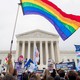 A gay-pride flagging waving in front of the Supreme Court