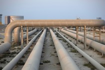 Photograph of a set of industrial pipelines in the desert