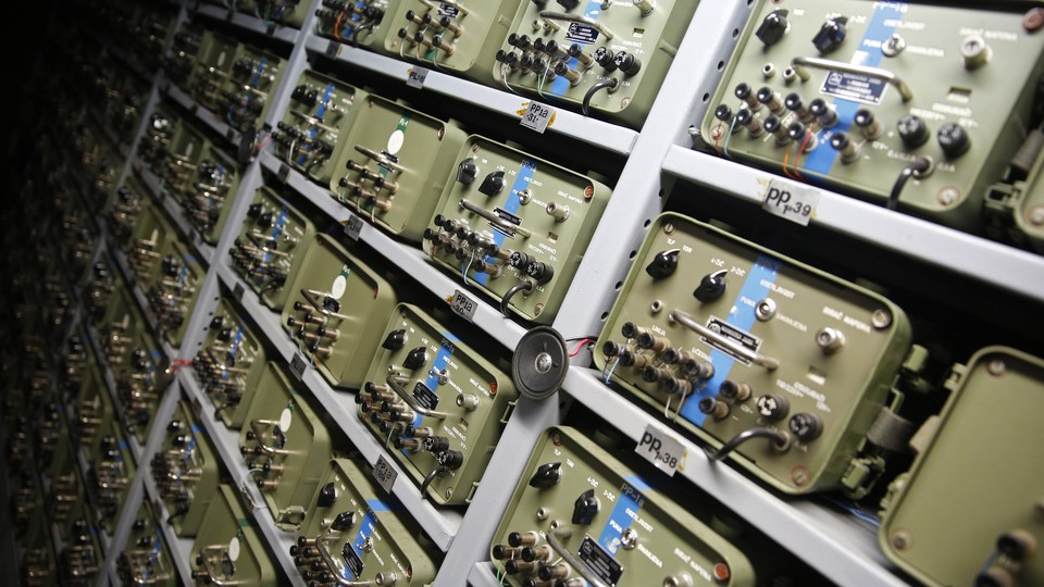 A large panel of telecommunications switchboards from the 1950s, photographed in a bunker in Bosnia and Herzegovina