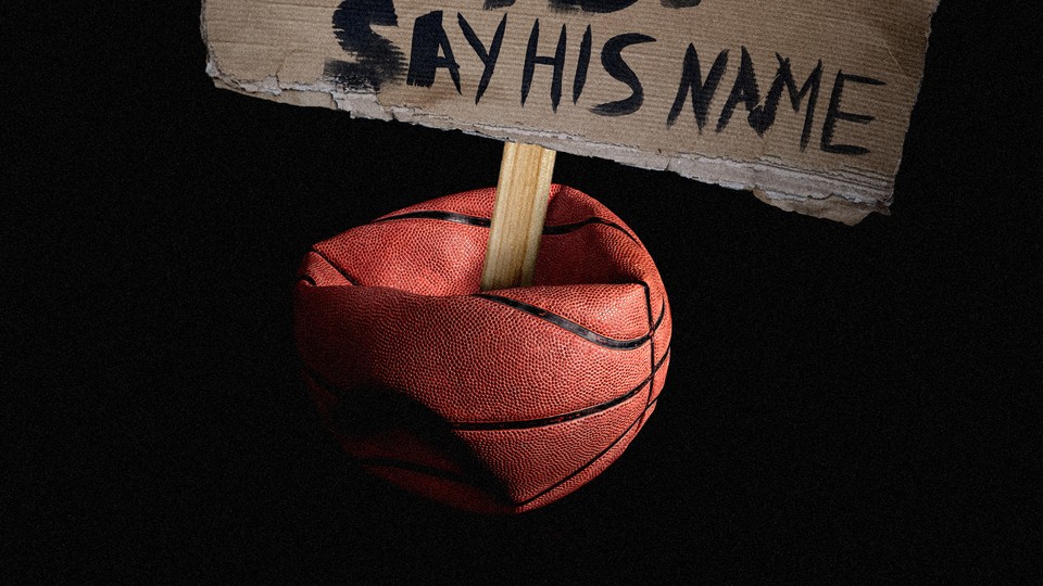 A protest sign stuck in a deflated basketball