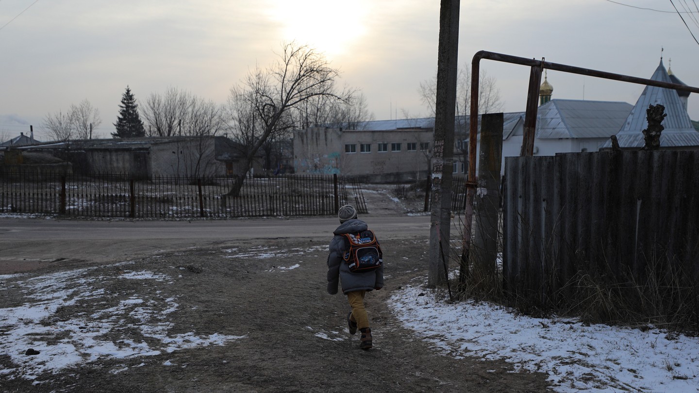 A boy goes to school in the village of Varvarovka, eastern Ukraine.