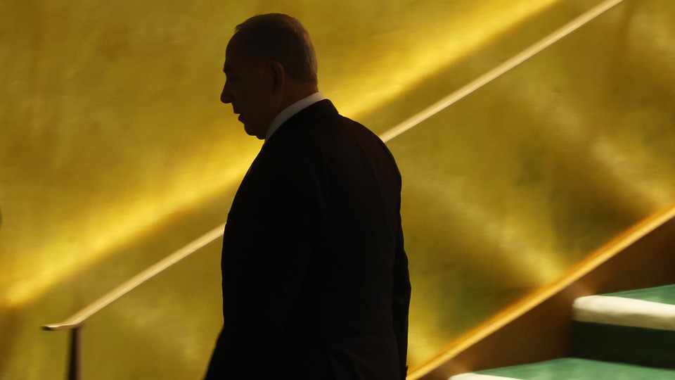 A photo of Benjamin Netanyahu walking away