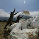 Nepalese men pile up garbage collected from Mount Everest on May 27, 2019