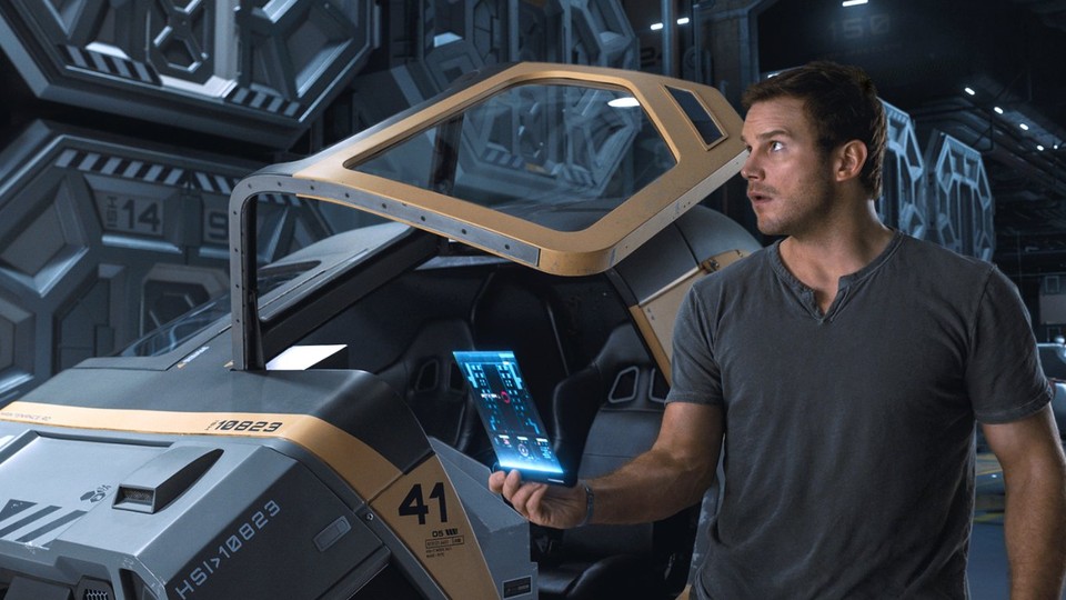 Chris Pratt stands in front of a hibernation pod in the movie Passengers.