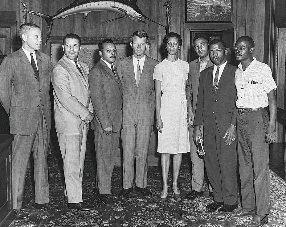 black-and-white group photo of 8 people including Robert F. Kennedy