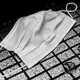 A surgical mask on the ground