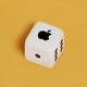 An image of a die with the Apple logo
