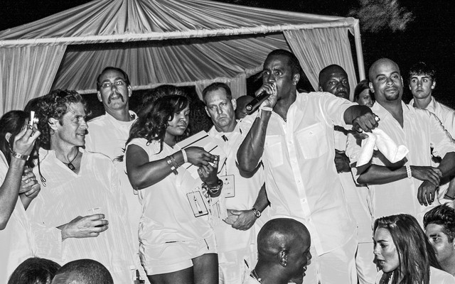 P. Diddy at the White Party surrounded by celebrities