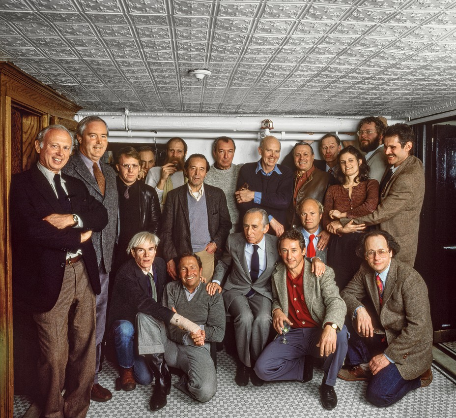 group photo of 19 artists including Ellsworth Kelly, Andy Warhol, Richard Serra, Jasper Johns, Claes Oldenburg, Edward Ruscha, and Robert Rauschenberg