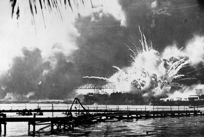 A view across the water of the explosion in Pearl Harbor