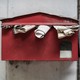 An old overflowing mailbox