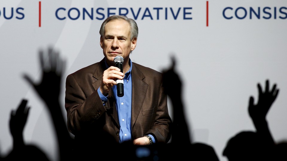 Texas Governor Greg Abbott speaks at a campaign rally for Ted Cruz in Dallas in February.