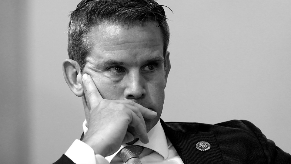 Adam Kinzinger in black and white