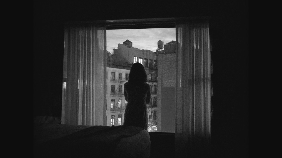 A girl looking out the window.