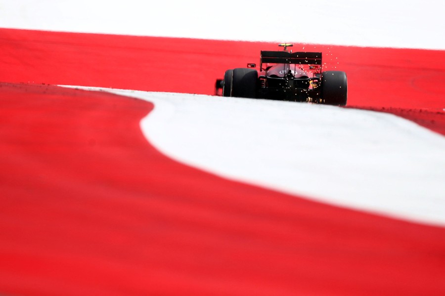 An F1 race car is seen speeding down a track.