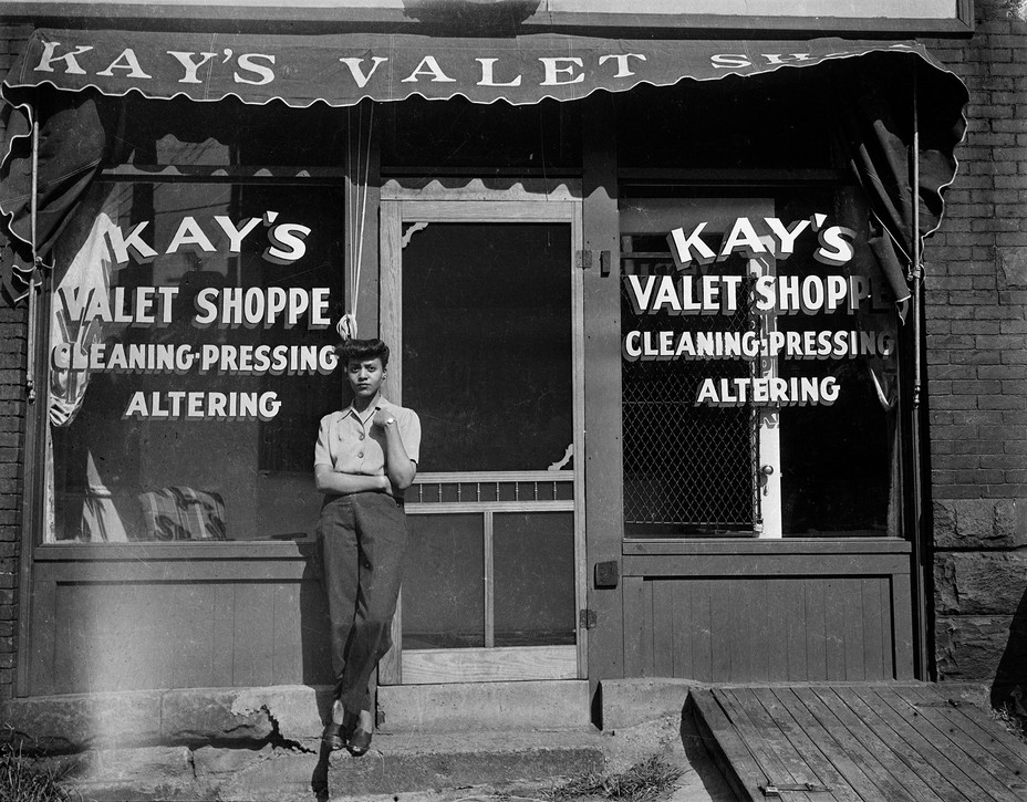 photo of woman outside Kay's Valet Shoppe ca. 1938–1945