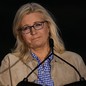 Liz Cheney in front of a microphone