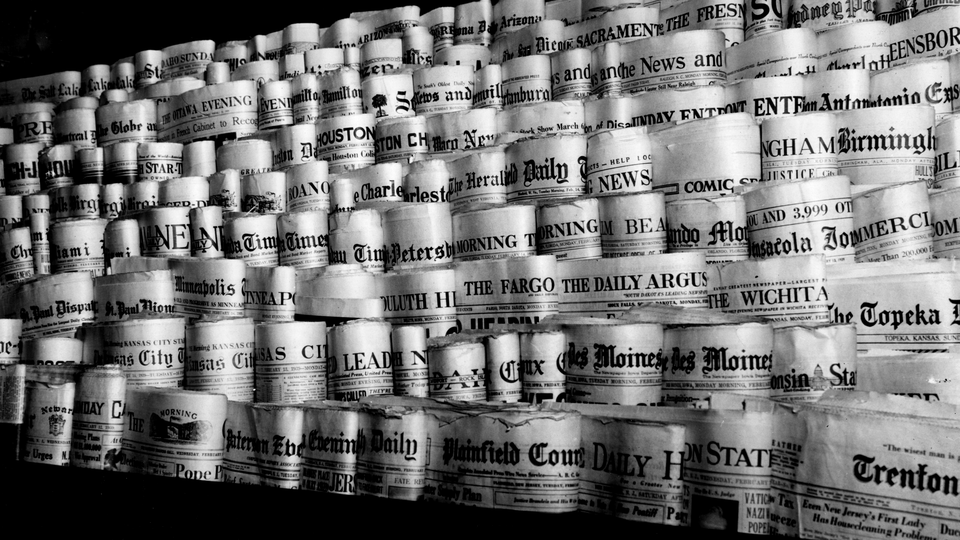 Rows of newspaper front pages