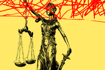 Lady Justice scrawled over with red