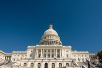 The U.S. Capitol under a vast blue sky