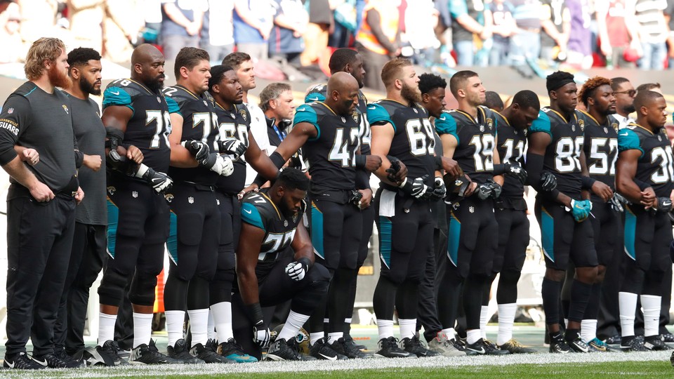 Patrick Omameh of the Jacksonville Jaguars kneels during the U.S. national anthem before a match in September 2017