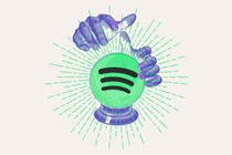 A pair of purple hands hover over a crystal ball, made of the Spotify logo