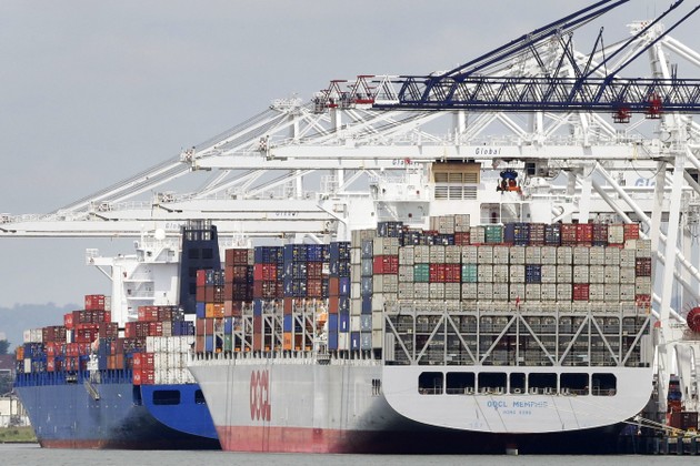 In this June 3, 2015 file photo, container ships are docked at a shipyard, in Jersey City, N.J.